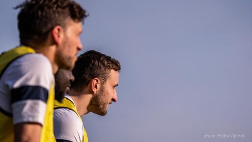 Błażej Święcicki of Krakow Dragoons FC watching a match by the sideline