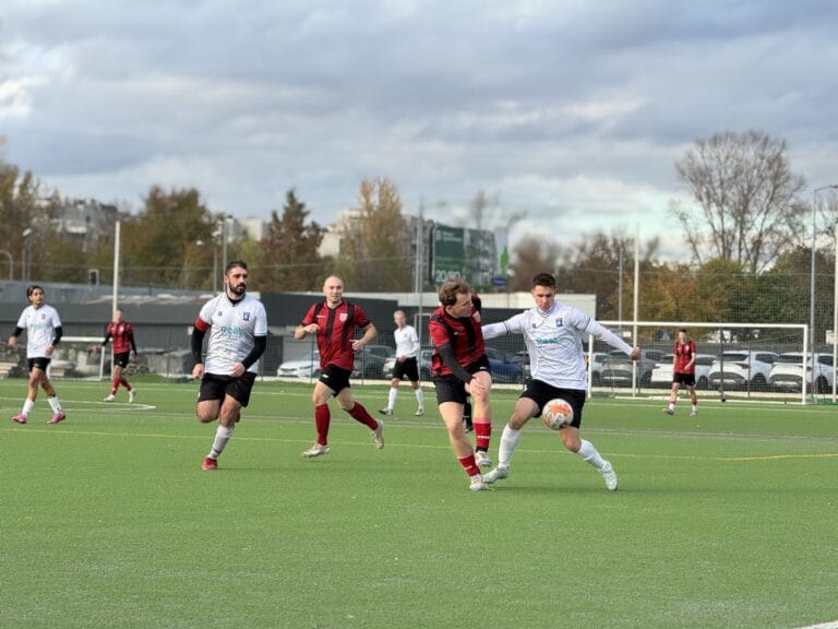 Players of Krakow Dragoons FC and KS Podgórze disputing a ball