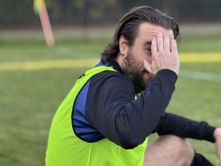 Mike Syska-Lamb of Krakow Dragoons FC funnily asking the photographer not to take any pictures of him