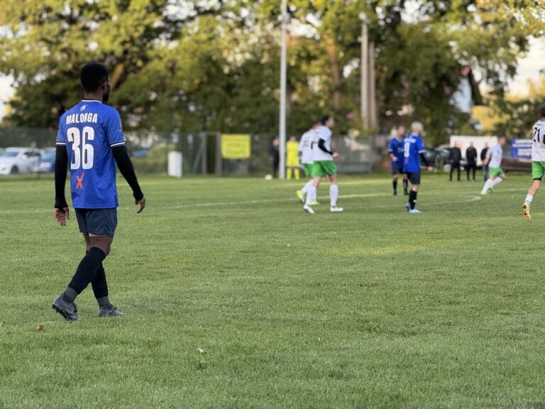 A shot of Corneille Malonga of Krakow Dragoons FC with other players in the background