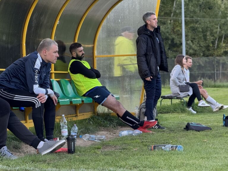 Krakow Dragoons FC bench watching the match with some consternation
