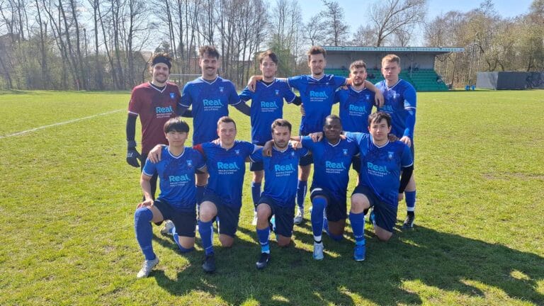 Krakow Dragoons FC players posing for a pre-match photo