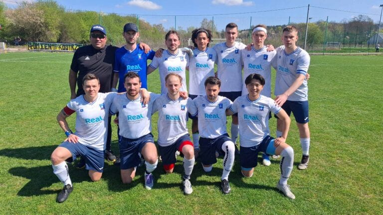 Krakow Dragoons FC players posing for a pre-match photo