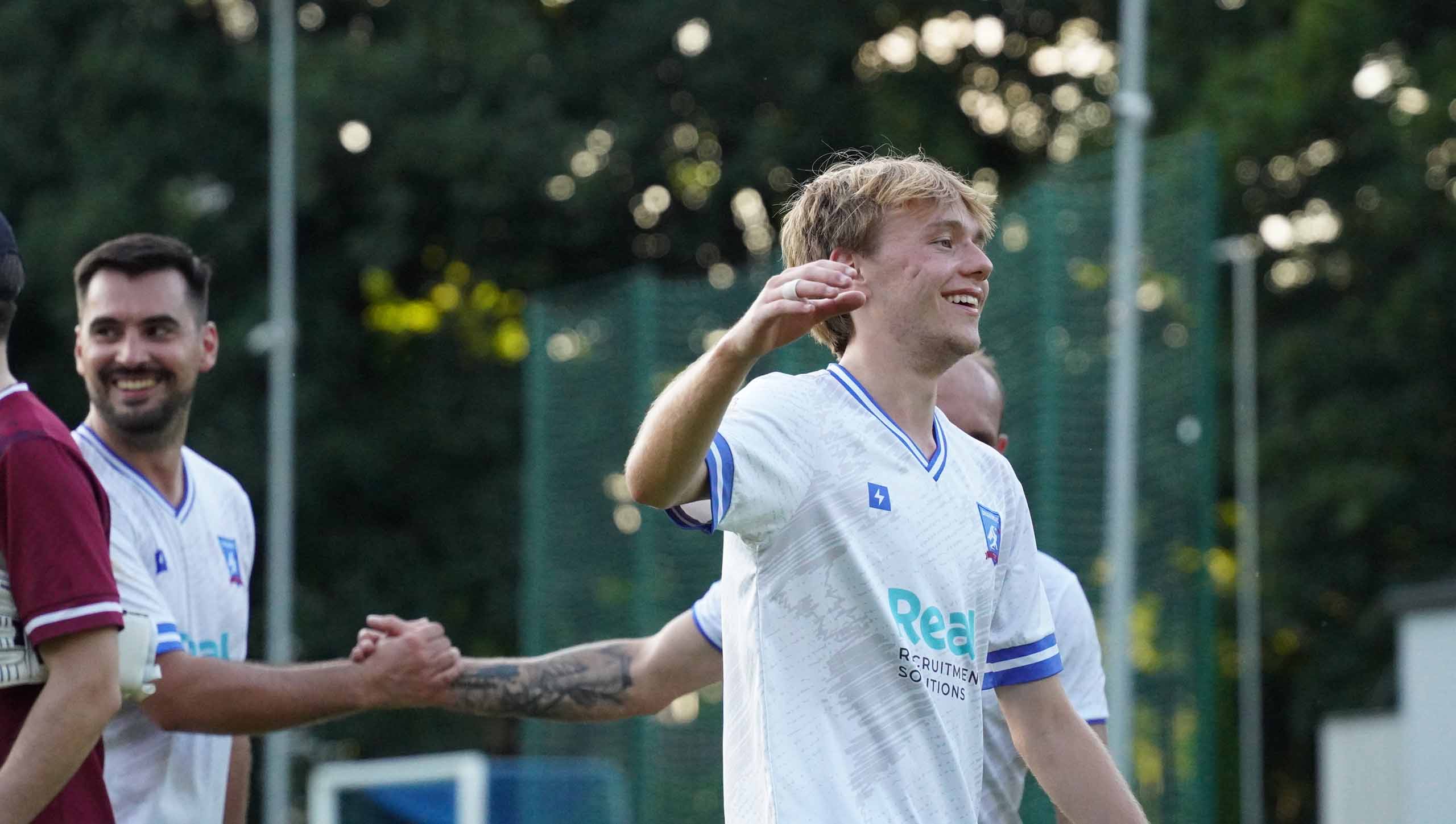 Jak Kołodziejski of Krakow Dragoons FC preparing to greet a team mate