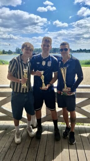 Krakow Dragoons FC players posing with their season award trophies