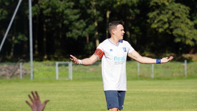 Enrico Forabosco of Krakow Dragoons FC opening his arms during a match